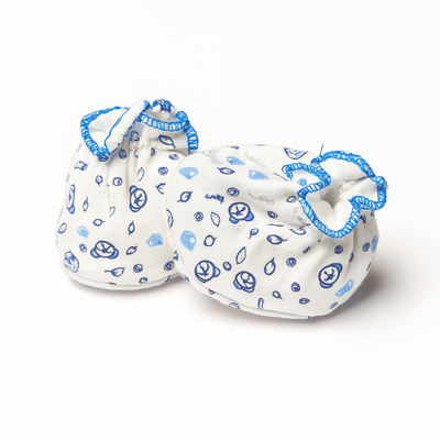 Pair of baby booties with blue patterns on a white background