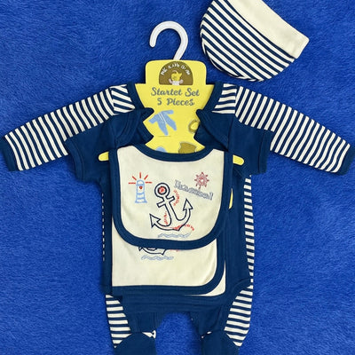 Baby outfit set with navy and white striped long-sleeve shirt, bib, and hat on a blue background.