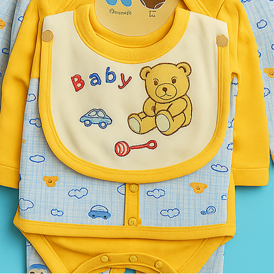 Yellow baby outfit with bib and onesie on a blue background
