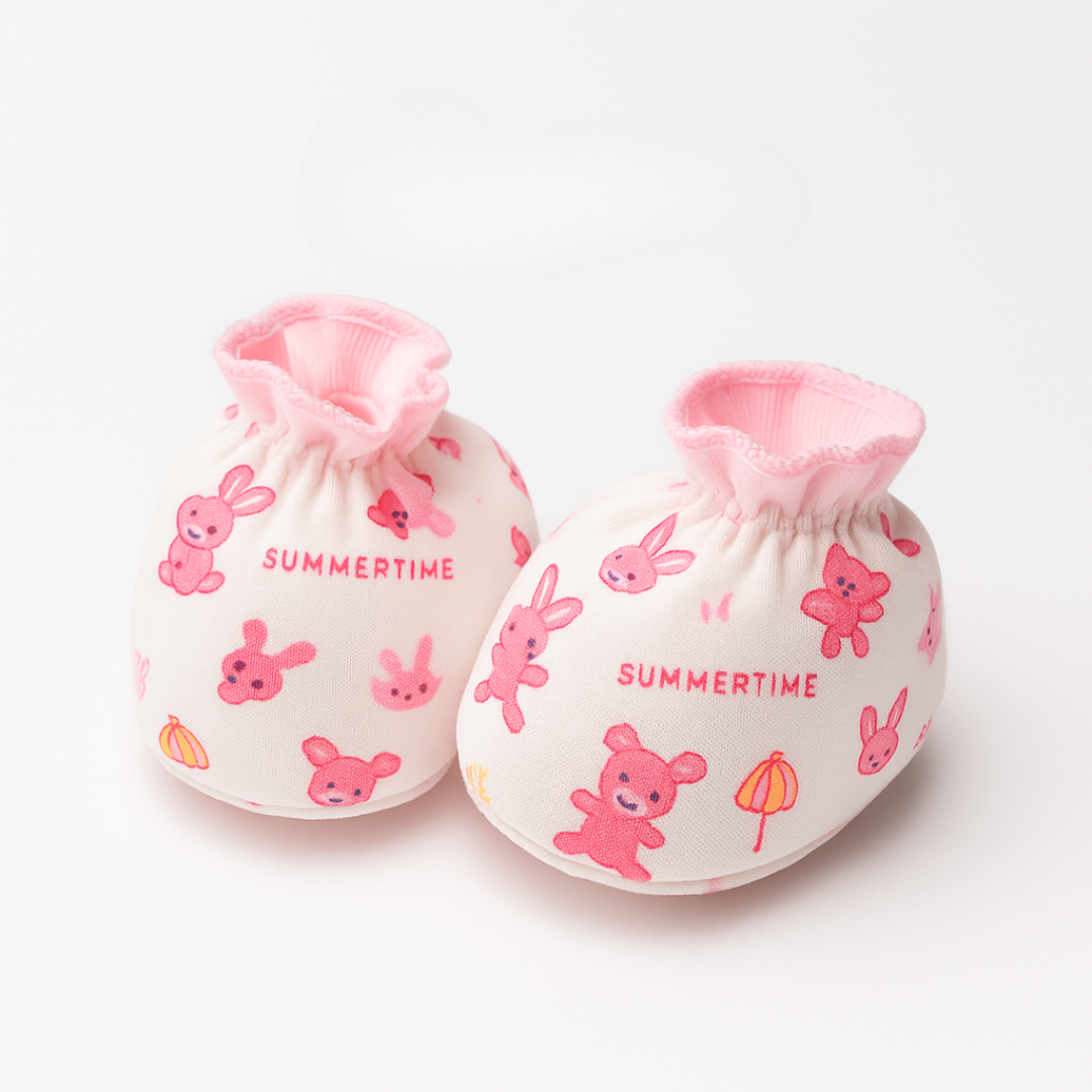 Pair of baby booties with pink bunnies and 'Summertime' text on a white background